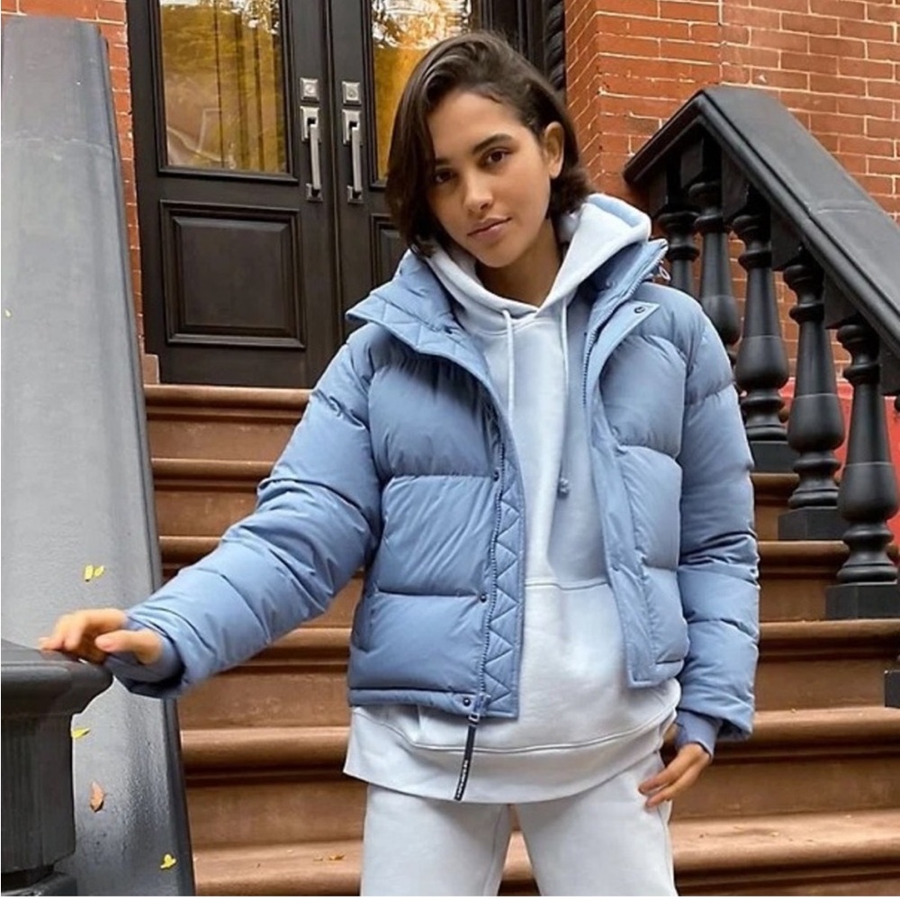Aritzia the super puff jacket in a light matte dusty blue